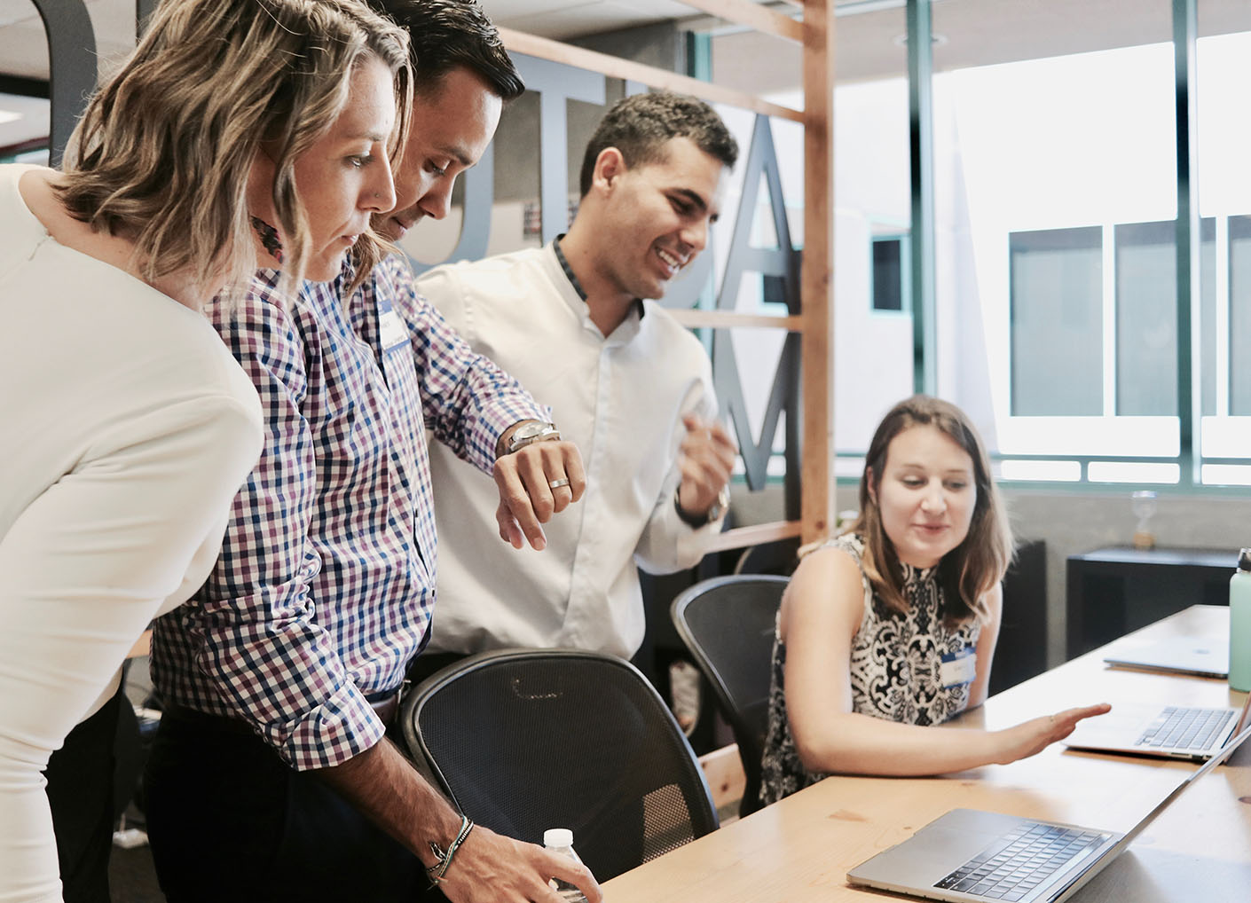 office workers standing at desk