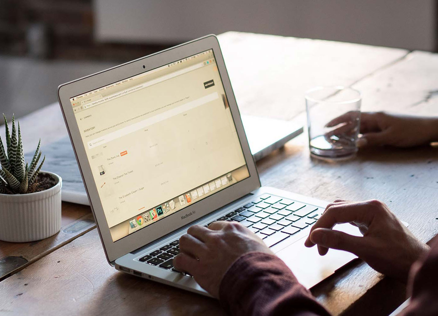 Person working at desk on laptop