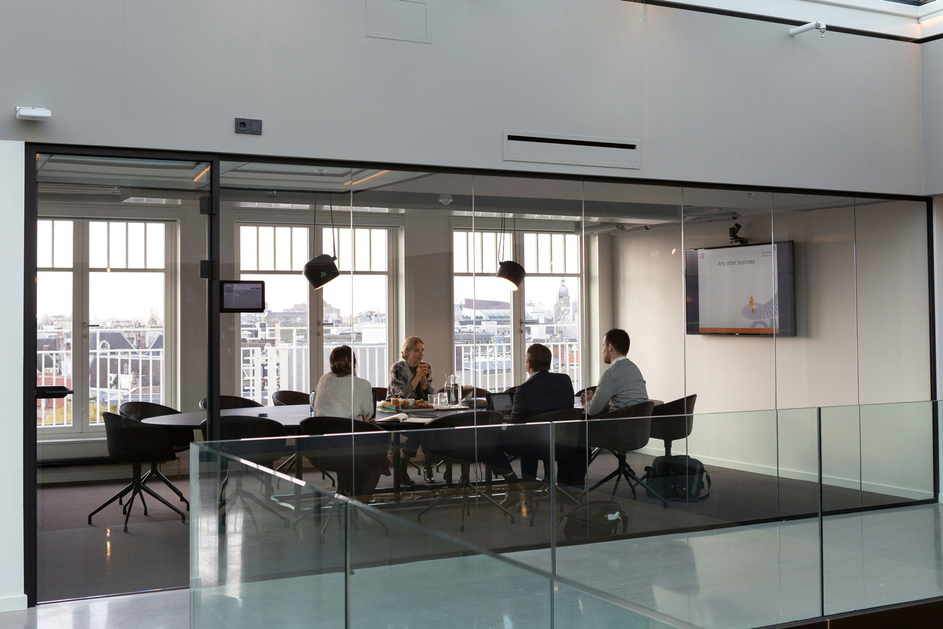 workers sitting at board room table