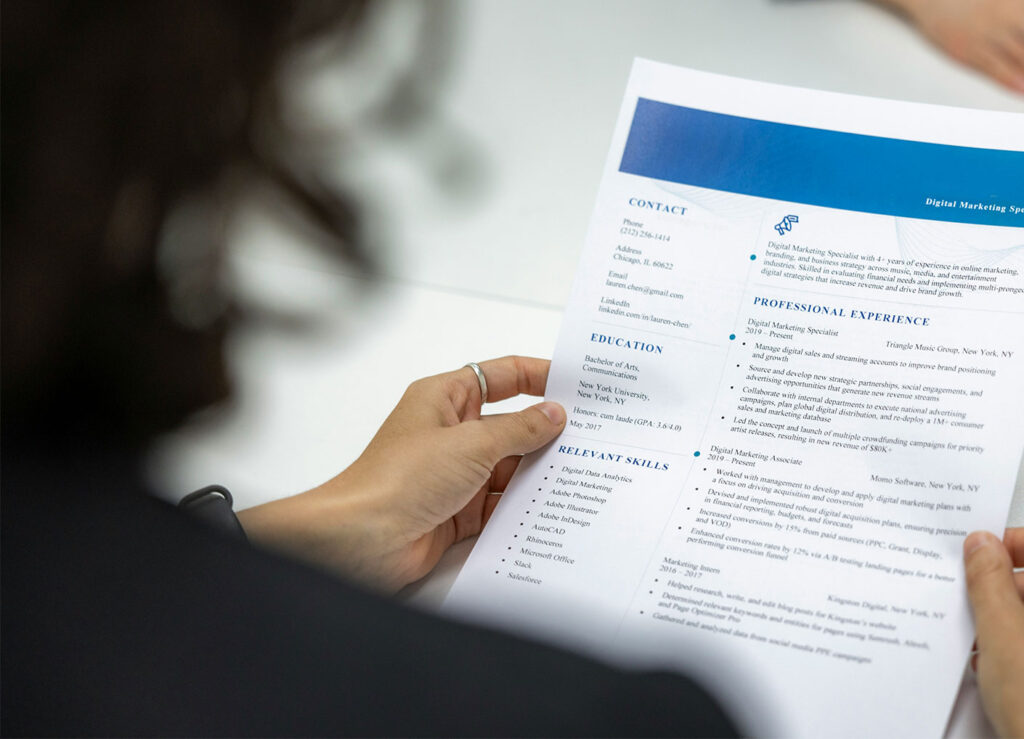 Woman inspecting resume